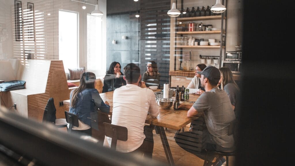 Group of people talking in a cafeteria