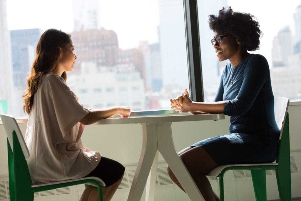 Woman interviewing another woman