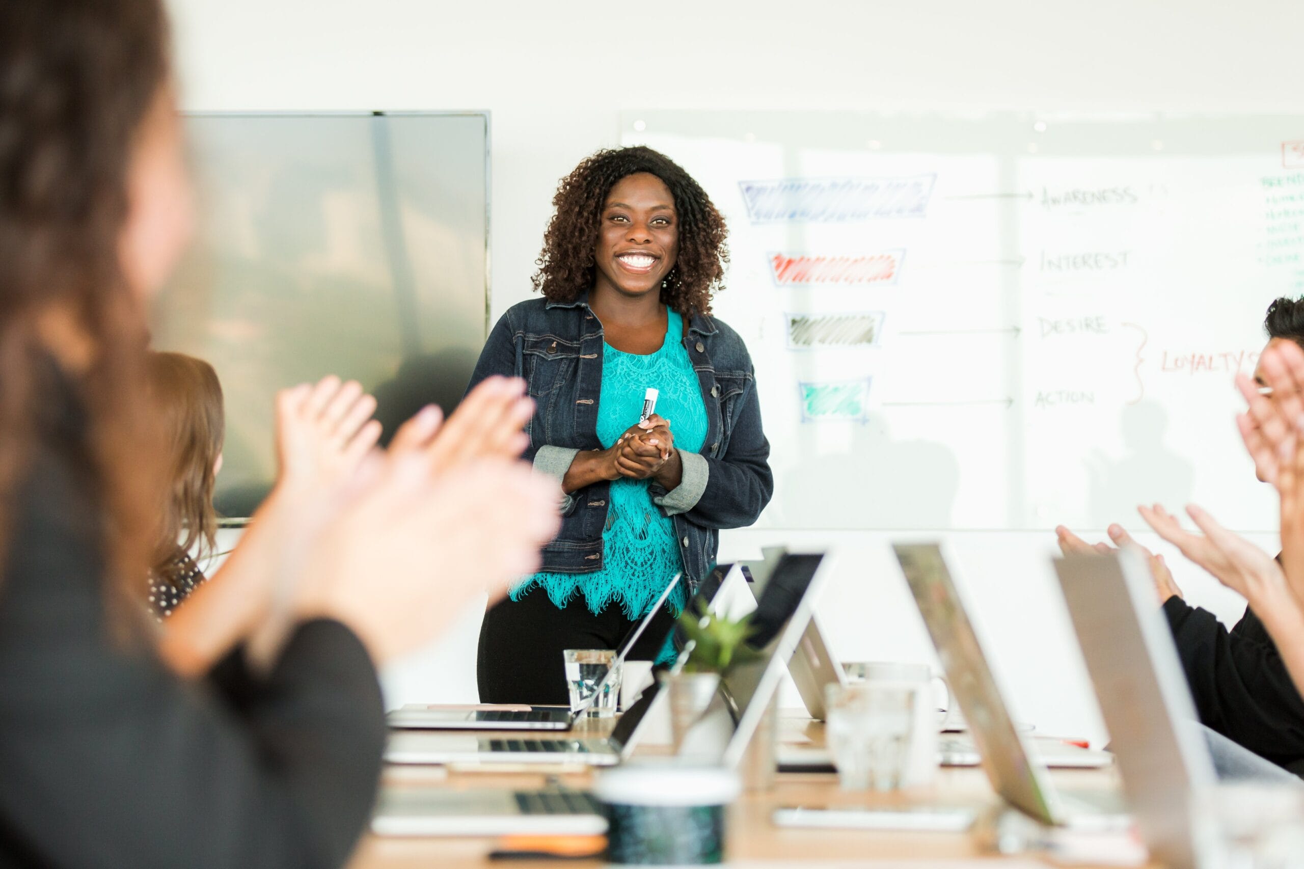 Woman looking happy leading a meeting